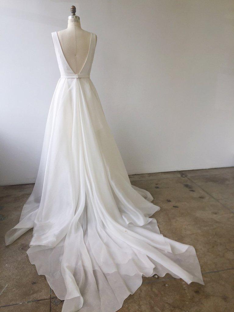 bustling a prom dress Lets talk bustles , First brief definition: A bustle is installed by a seamstress as a built in way to pull your train off the floor when you choose. , Why I recommend getting a bustle installed Sleeveless Back 3 Ways to Bustle a